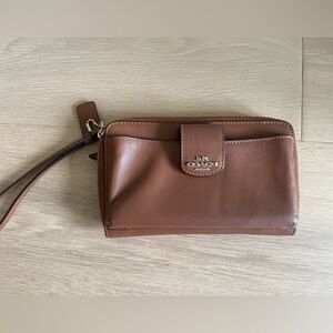 Saddle brown Coach wristlet